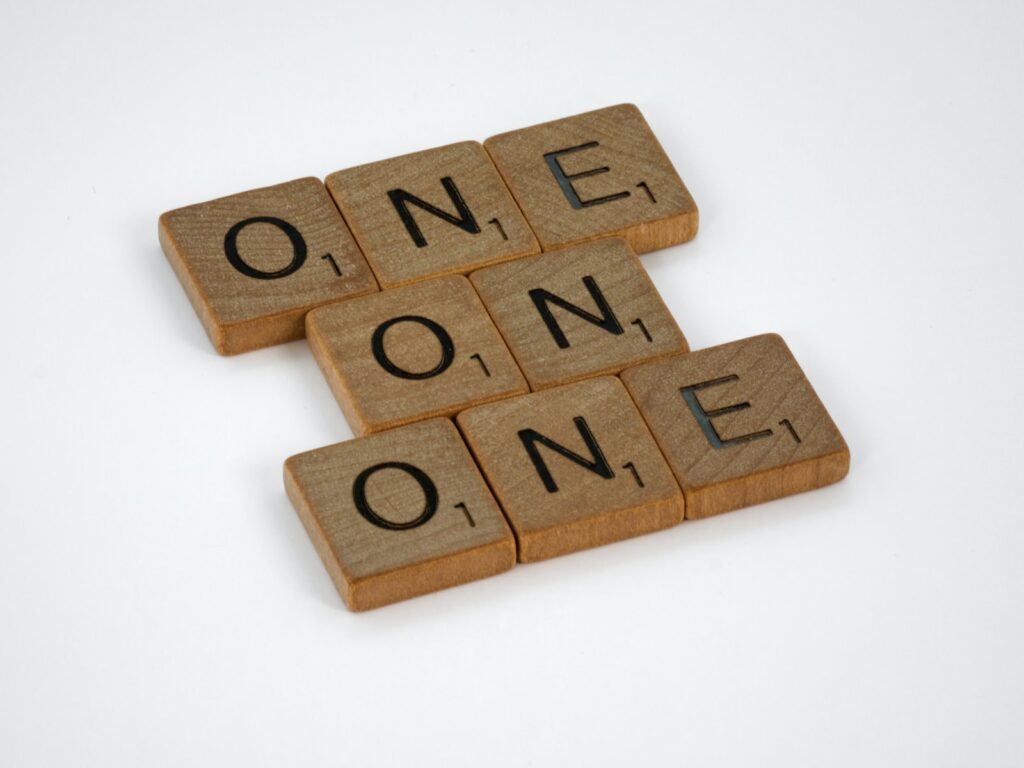 brown wooden letter blocks on white surface